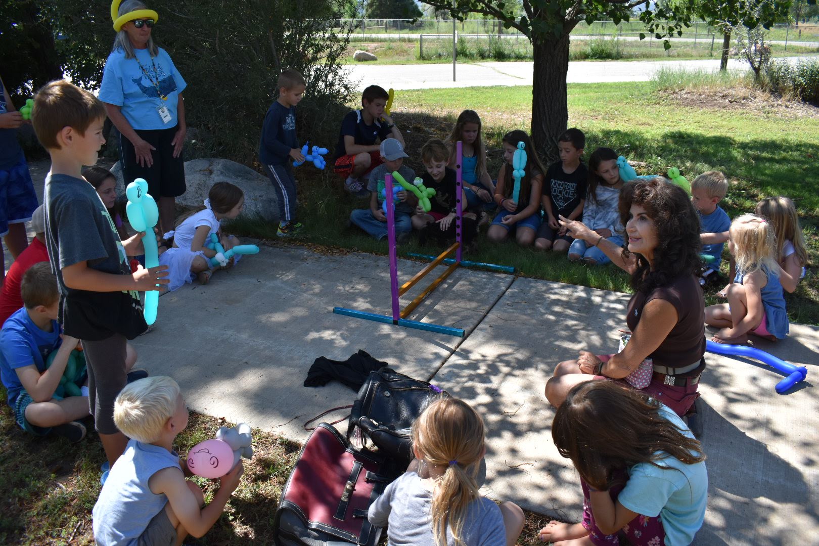 Children enjoy summer reading activities outdoors.