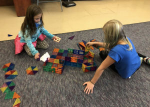 Kids playing with magnet blocks